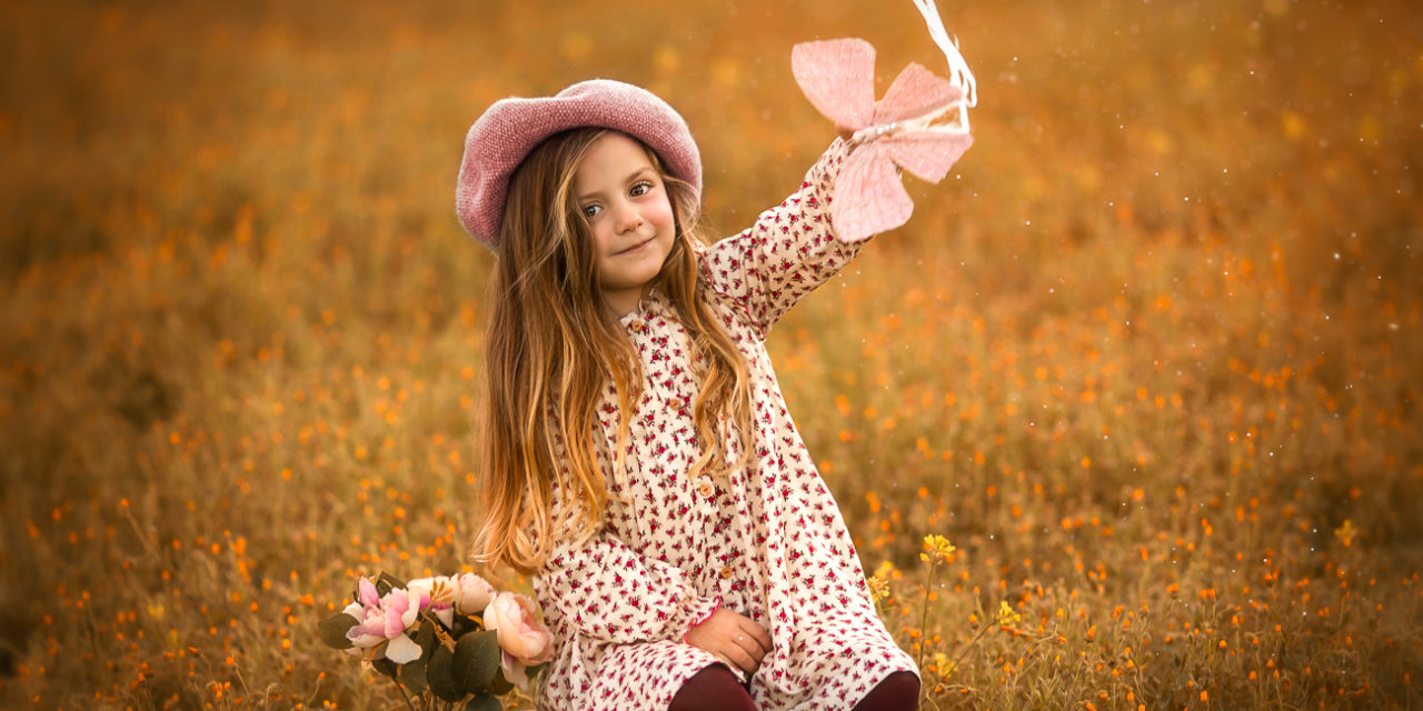 niña con mariposa